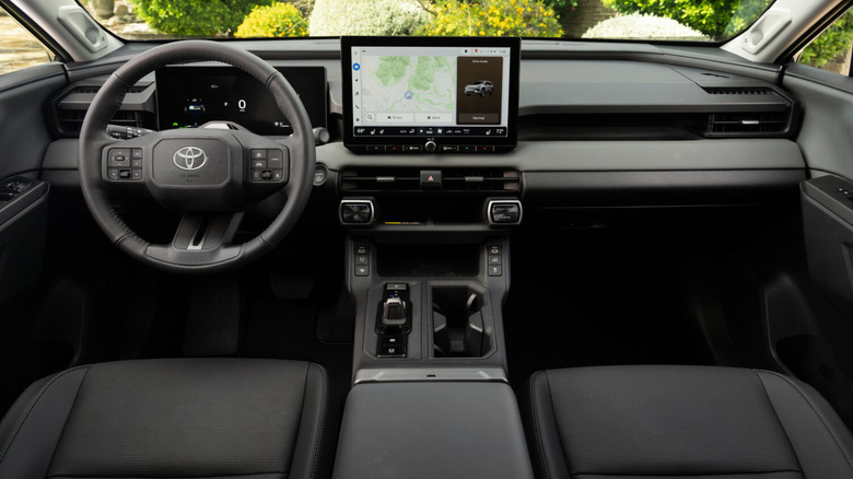 The interior front seats and dashboard of a 2026 Toyota RAV4