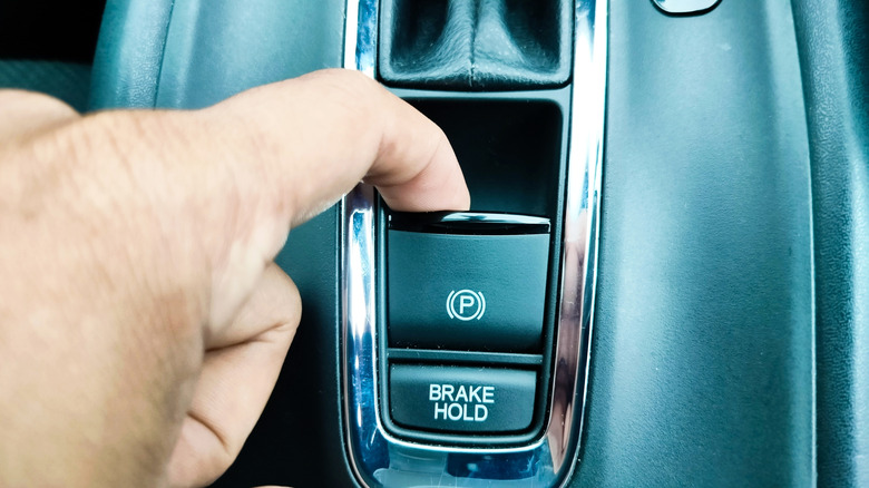 A digit pulling up connected an physics parking brake switch