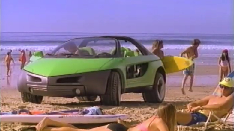 The Pontiac Stinger, is parked on a busy beach in a promotional video for the youthful concept vehicle.