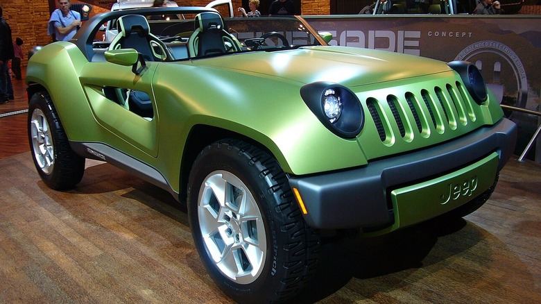 A green, futuristic buggy-like convertible "truck"-car, or the Jeep Renegade Concept in 2008.
