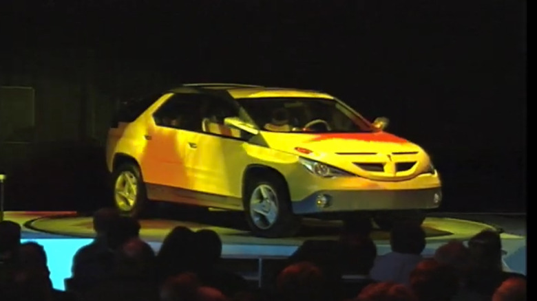 The original Pontiac Aztek concept debuting on stage at an auto show.