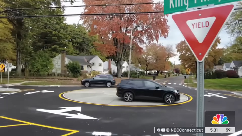 A Volkswagen ID.4 drives straight through the middle of a roundabout in Connecticut.