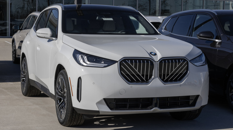 A 2026 BMW X3 parked in front of a dealership.