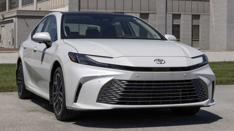 A 2026 Toyota Camry parked in front of a building.
