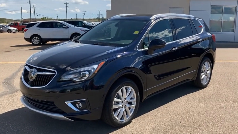 A used black 2020 Buick Envision at dealership lot
