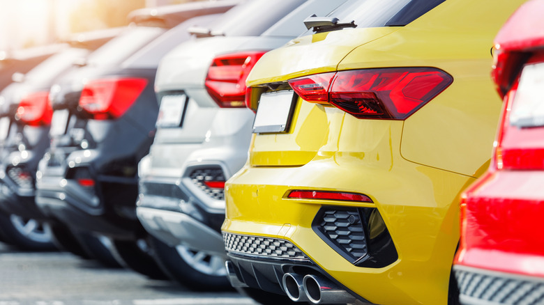 A rear shot of multiple SUVs parked together on a car lot