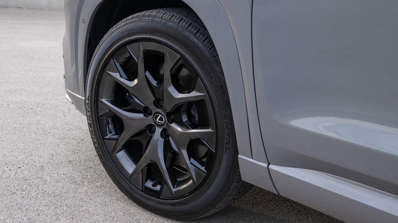 Dark alloy wheel from a gray 2026 Lexus TX Hybrid