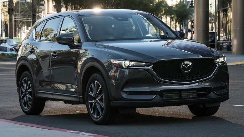 2018 Mazda CX-5 parked on the side of the street with buildings in the background