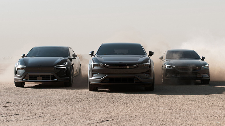 Polestar lineup of vehicles driving over sand