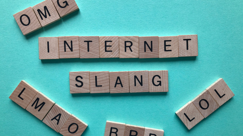 Stock image of scrabble tiles saying "OMG," "INTERNET SLANG," "LMAO," "BRB," and "LOL."