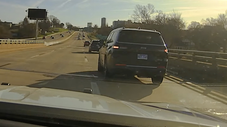 Dillon Hess's Jeep Grand Cherokee driving with its flashers on, which should tell police he is looking for somewhere to pull over