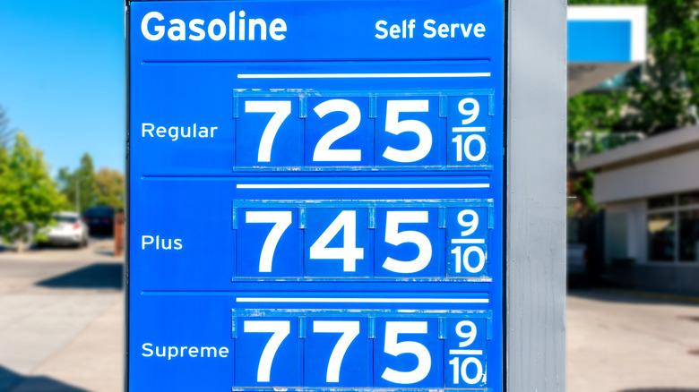 Gas station price sign showing record high gasoline prices for over seven dollars a gallon of regular gas.