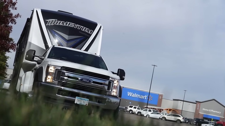 A fifth-wheel RV parked at Walmart