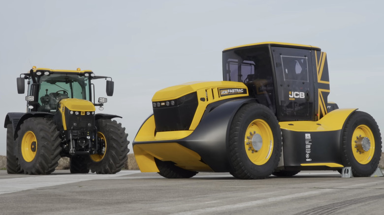 A JCB Fastrac Two with another JCB tractor parked on concrete