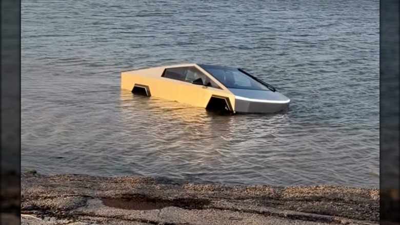 A Cybertruck sits immobilized on the shoreline of a Texas lake after attempting to test the truck's 
