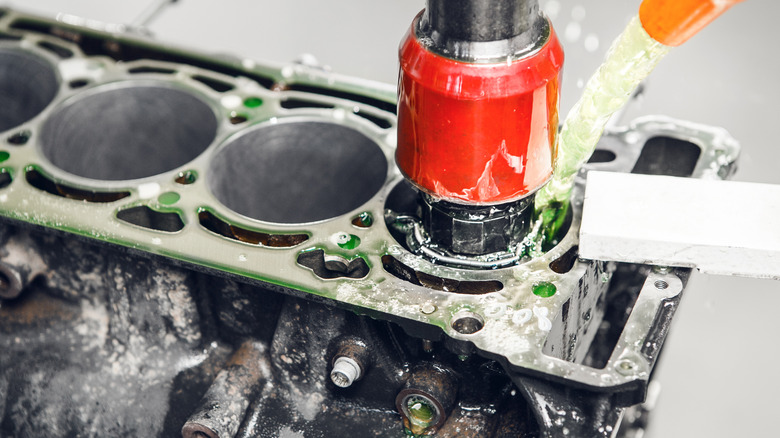 A CNC machine being used to hone an engine's cylinders