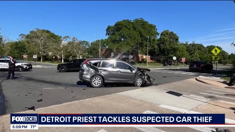 Image of the crash in Detroit with a small silver SUV that sustained damage to the passenger rear and front end.
