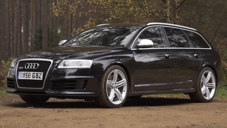 A black Audi RS6 Avant with silver wheels