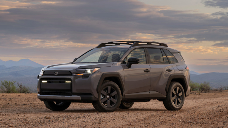 Front 3/4 of 2026 Toyota RAV4 Woodland at dusk in a desert environment