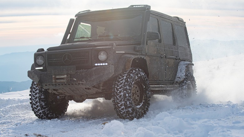 Mercedes vehicle off roading in snow