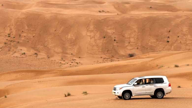 SUV off roading on sand dunes