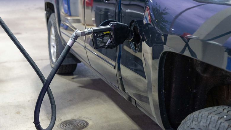 A truck being filled up with fuel