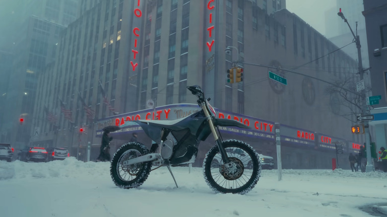 A dirt bike in the snow next to Radio City Music Hall