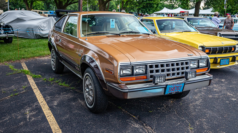A brown AMC Eagle crossover in a parking lot