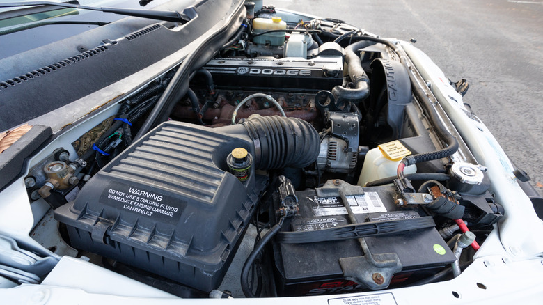 White Dodge Ram 3500 Cummins 24 Valve Turbo Diesel 4x4 American pickup truck engine bay