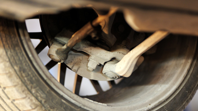 A close up view of the outer tie rods visible in a car's suspension