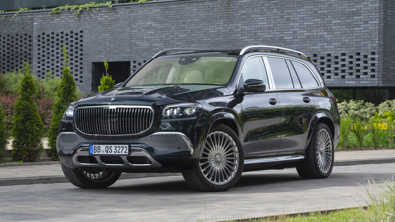 A dark blue Mercedes GLS 680 parked on a driveway.