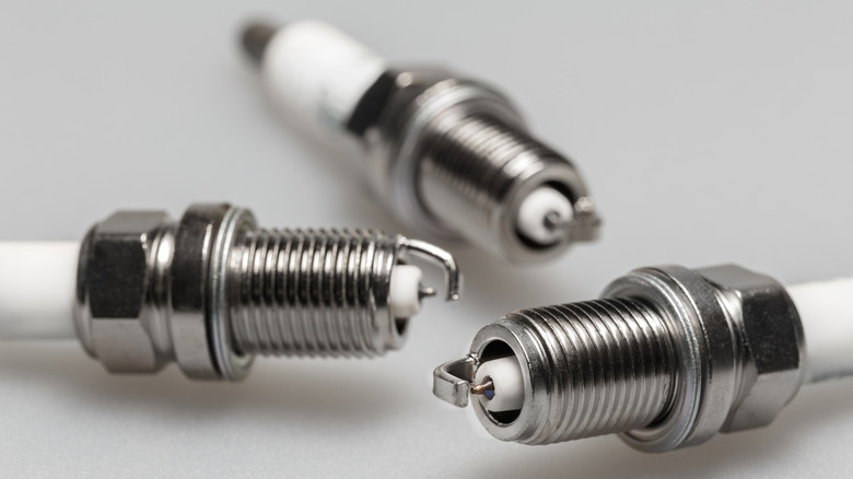 Close-up view of three new iridium spark plugs