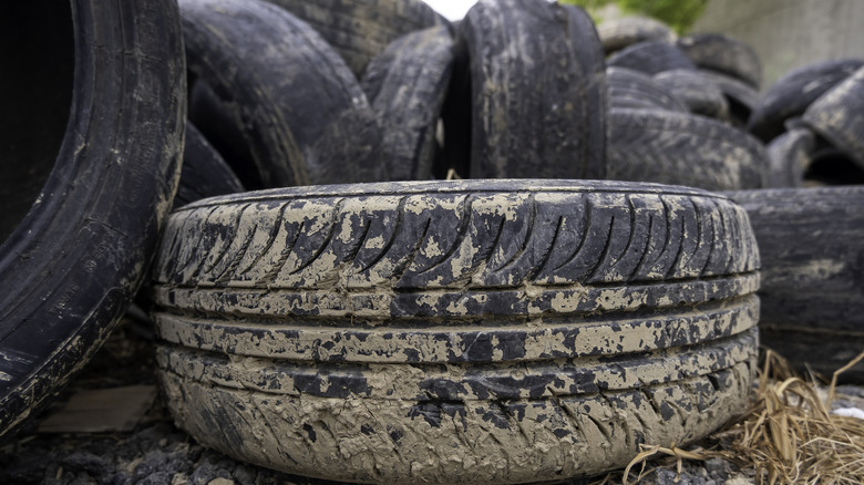 A pile of used tires outside