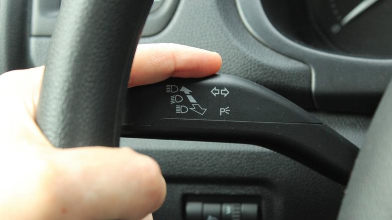 A closeup of a turn signal stalk