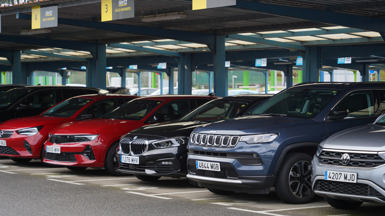 A row of miscellaneous rental cars at Hertz location