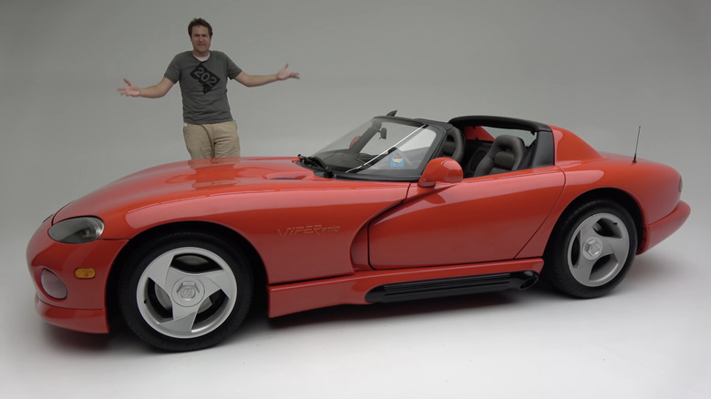 Doug Demuro standing next to a Dodge Viper