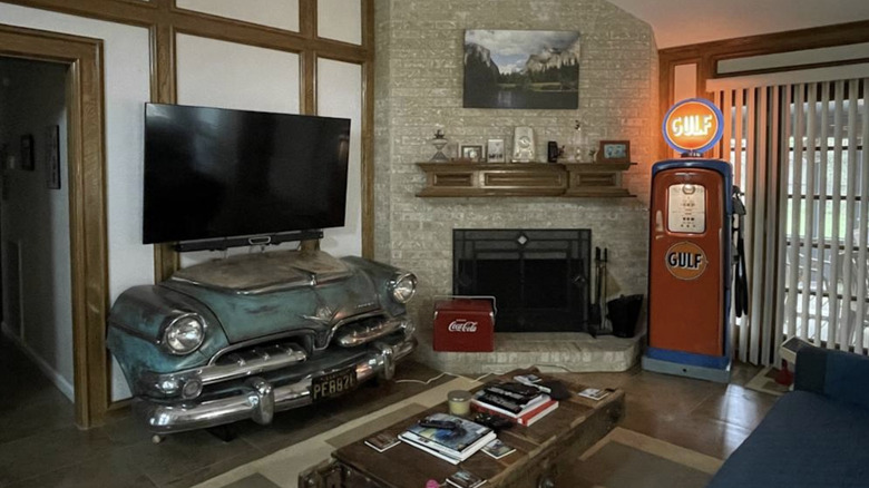 A living room with the front of a dodge