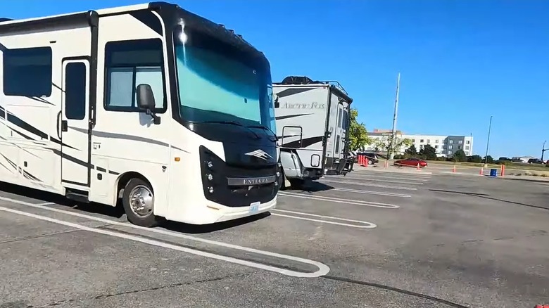 A few different RVs overnight parking at a Costco