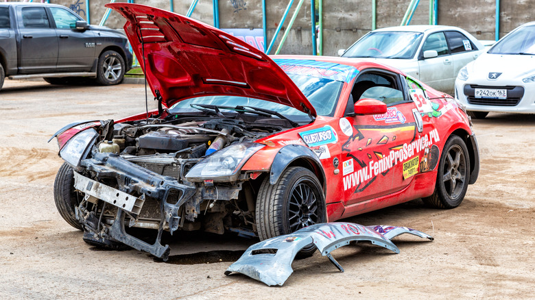 A collapsed reddish Nissan 350Z