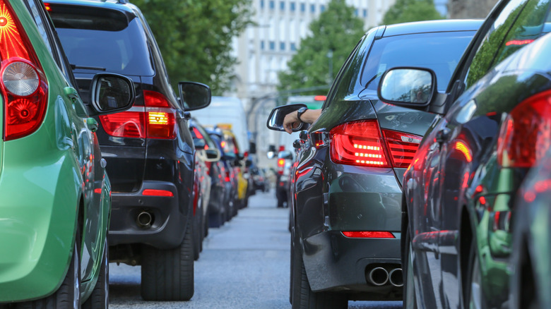 A slew of vehicles idling in a traffic jam