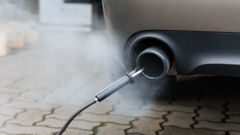 Measuring the emissions from the tailpipe of a sedan