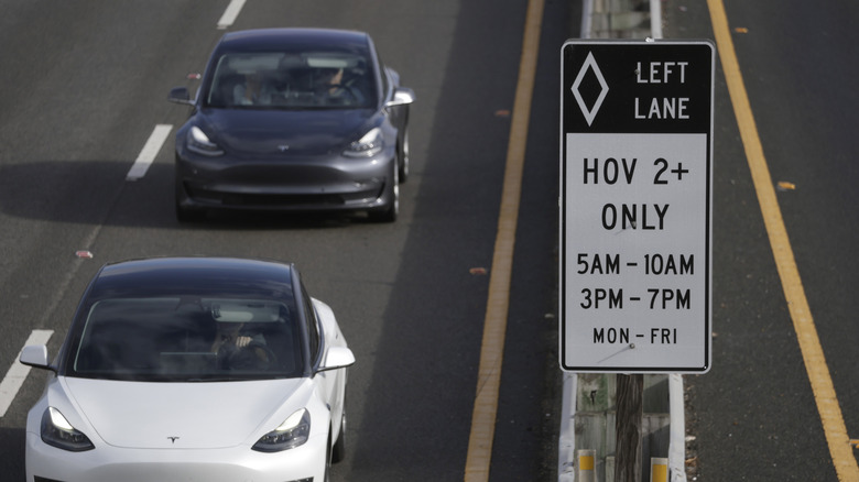 Tesla cars drive in the high occupancy vehicle (HOV) lane on Highway 101 on September 30, 2025 in Larkspur, California.