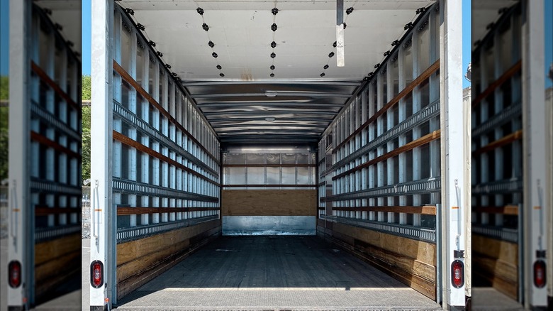 The back of a semi truck, empty.