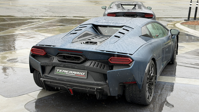 Rear 3/4 view of a matte blue Lamborghini Temerario