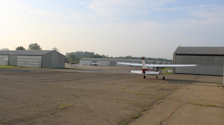 Oakland Southwest Airport, New Hudson, Michigan, planes in hangar area