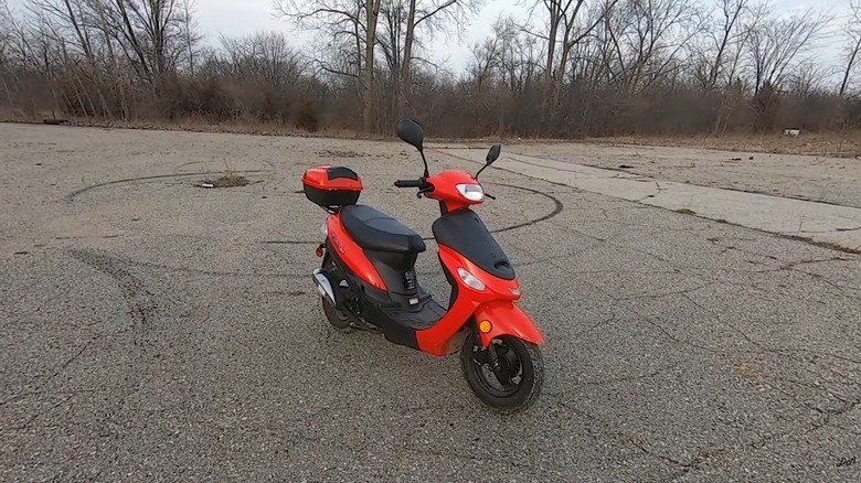 A 50cc Taotao Pony moped in red on concrete
