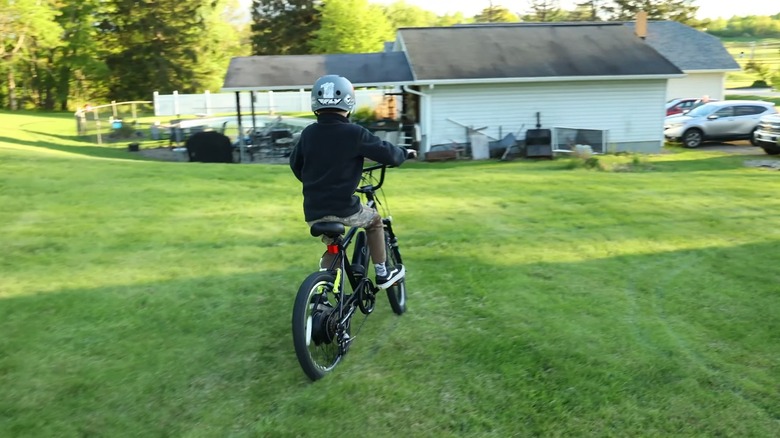 A kid riding an e-bike and getting exercise