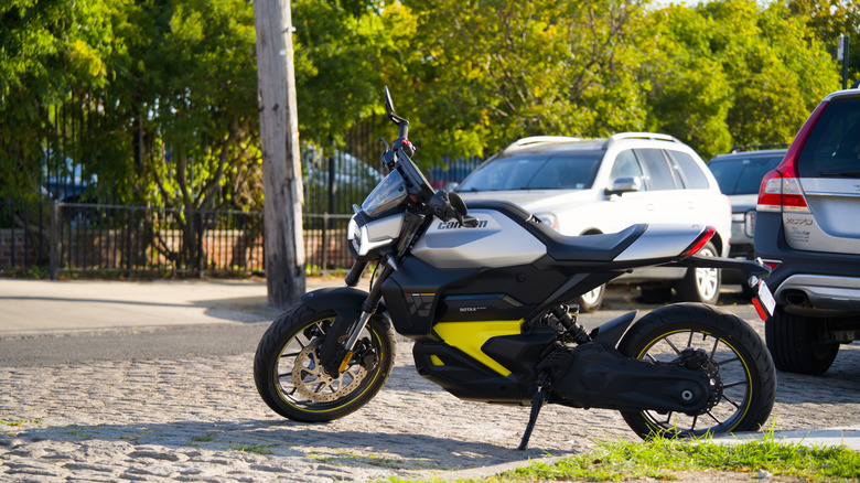 The Can-Am Pulse motorcycle parked connected a cobblestone street