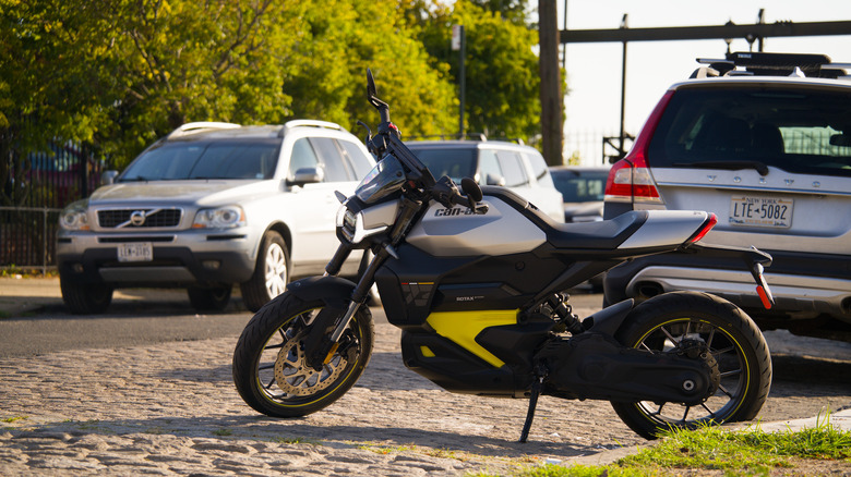 The Can-Am Pulse motorcycle parked connected a cobblestone street