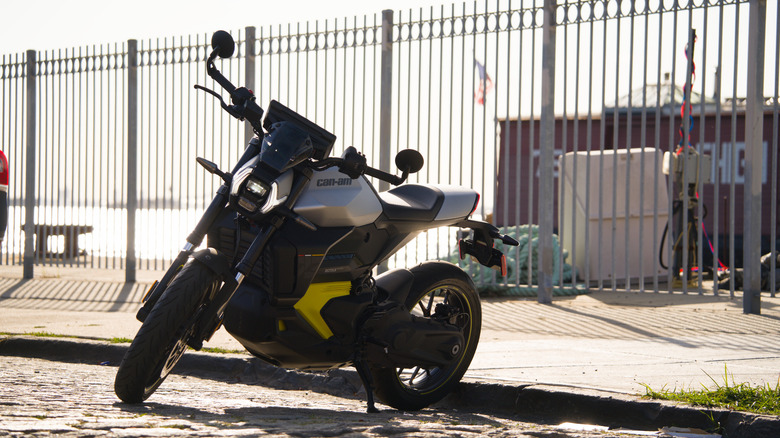 The Can-Am Pulse motorcycle parked connected a cobblestone street